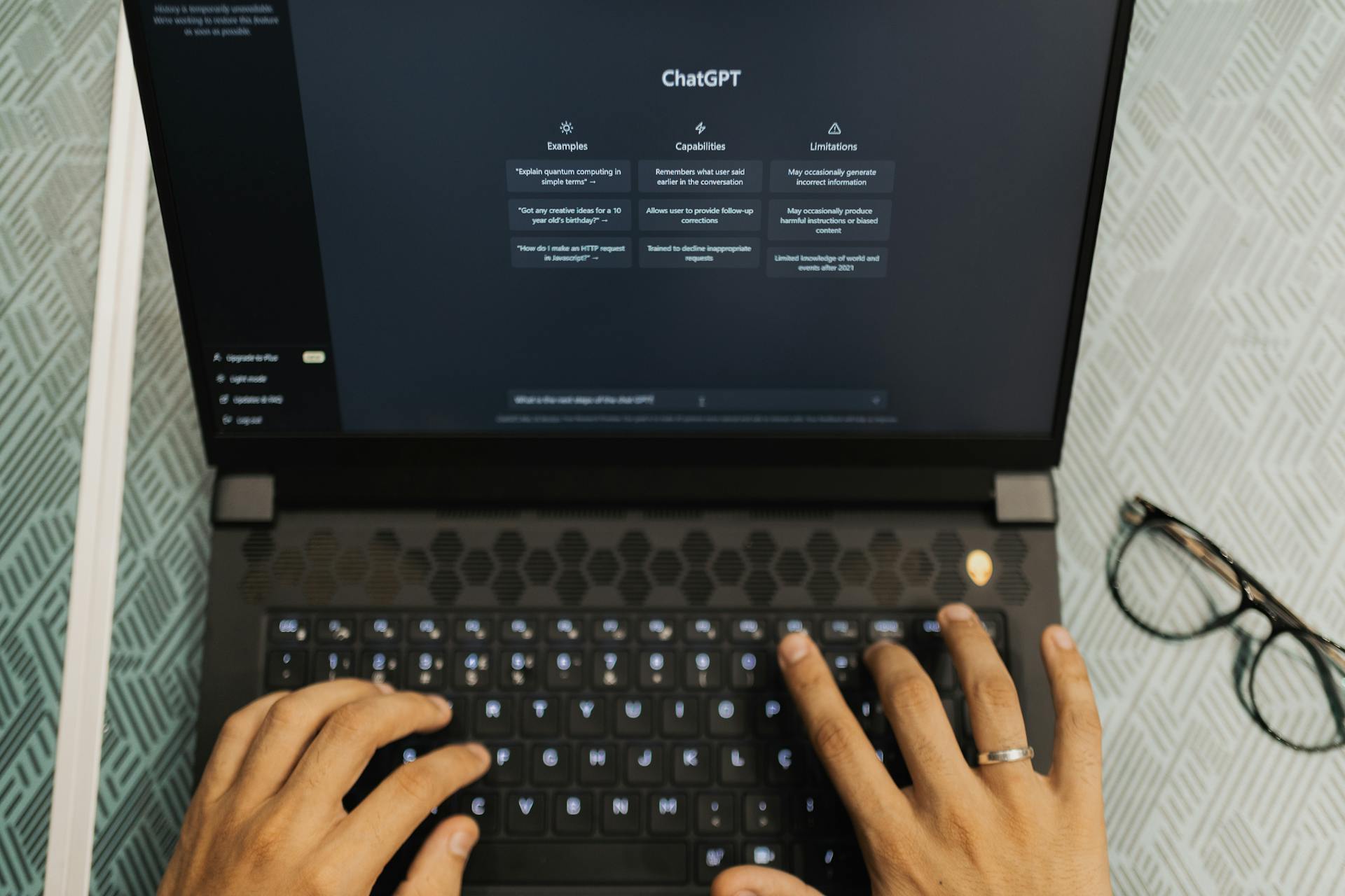 Person typing on a laptop with ChatGPT open on the screen, representing AI-assisted content creation, SEO strategy development, and digital marketing automation tools.